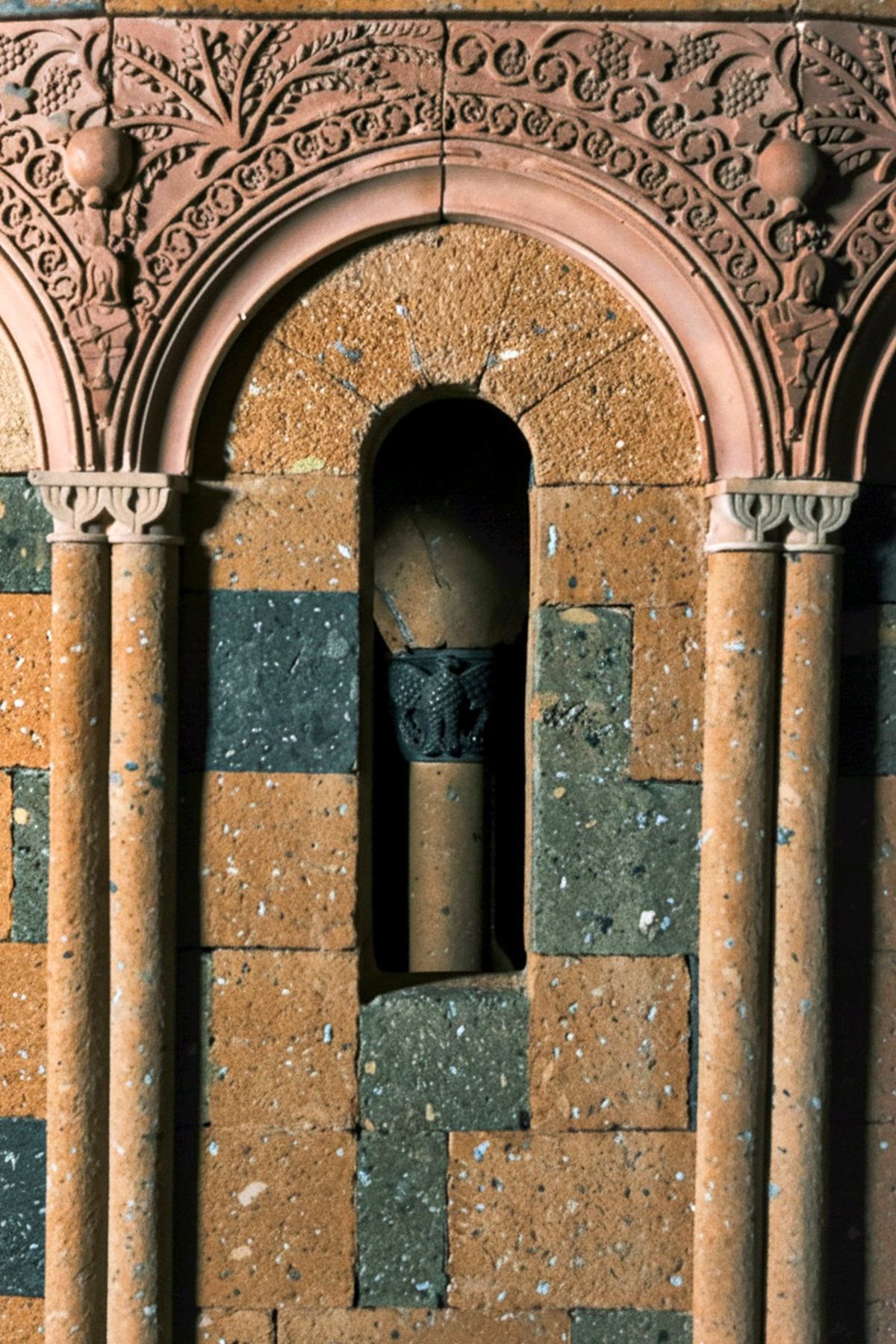 Detail of a hand-carved stone arch on the tufa maquette of Zvartnots Cathedral.